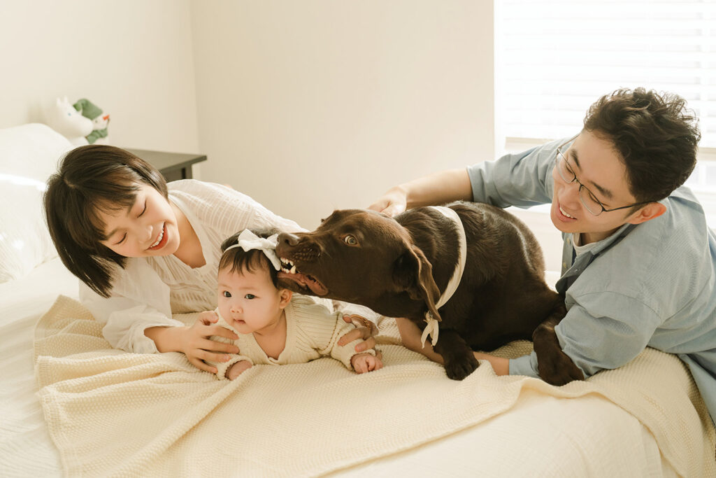 cute newborn kid with dog family photo in NJ